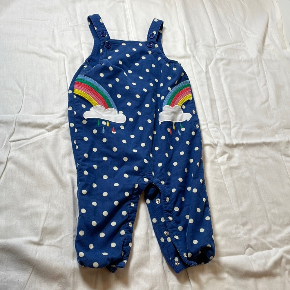Blue corduroy overalls with embroidered rainbow detail